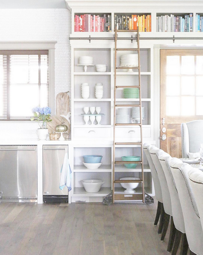 Cabinet library ladder. So fun to restyle...my open shelves in the family kitchen showcasing a rainbow cookbooks, everyday dishes, jadeite, milk glass and vintage enamelware. #libraryladder #kitchen #cabinet cabinet-ladder Home Bunch's Beautiful Homes of Instagram @artfulhomestead