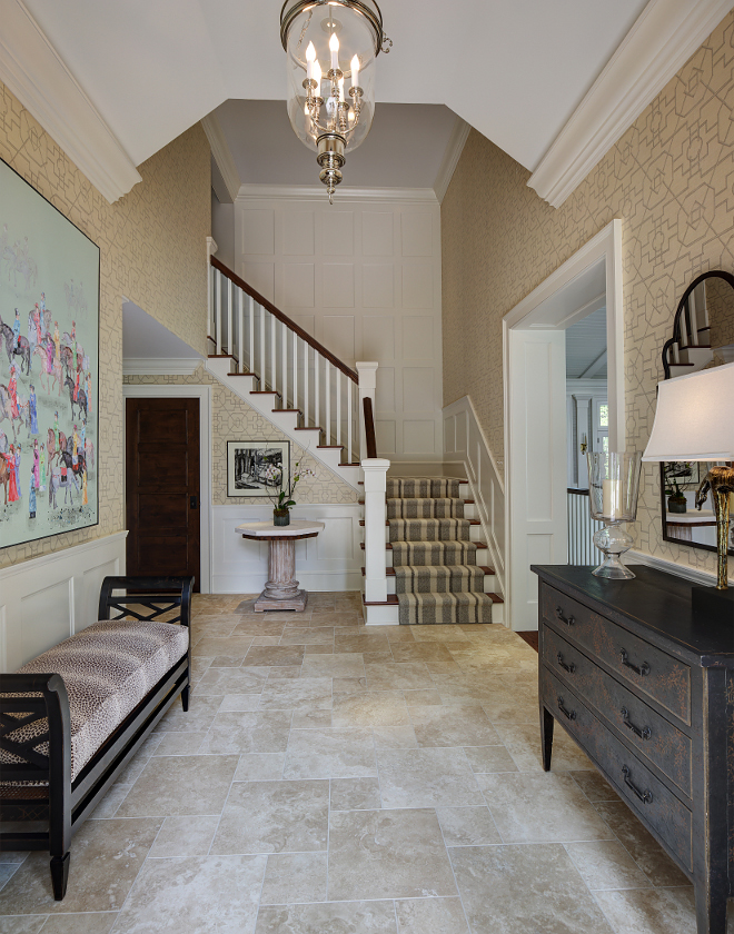 Entry. This welcoming entry is full of personality and elegance. A Thibaut printed grasscloth wallcovering perfectly complements the limestone flooring. Lighting is Polished nickel Bell Lantern from Visual Comfort. #entry #wallpaper #Thibaut #wallcovering #limestone #flooring W Design