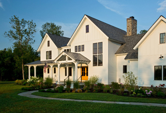 Farmhouse exterior. Seven standing seam metal roof gables rise above the level site. #Farmhouse #farmhouseexterior Teakwood Builders, Inc. Scott Bergmann Photography