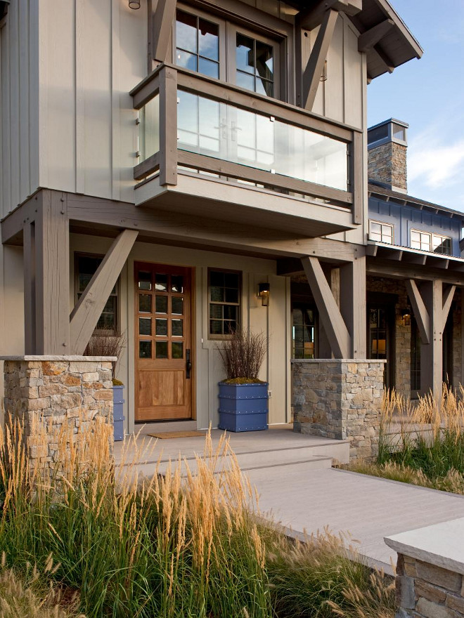 Modern Rustic Exterior. Rutsic Home exterior. Sculptural in quality, timber trusses, siding, corrugated roofing and a Juliet-style balcony are unifying features of the home's modern rustic architecture. Front door is walnut. #Rusticexterior #rustichomes #homeexterior #rustichomeexterior Home Bunch's Beautiful Homes of Instagram - @artfulhomestead - Image by HGTV.