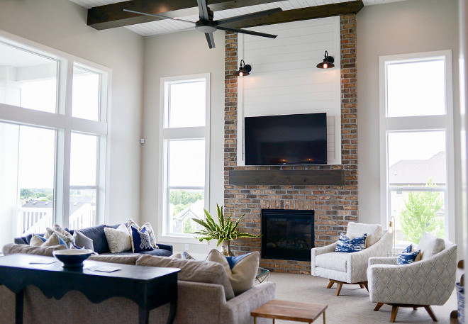 High Ceiling family room. A family room with high ceilings and with floor-to-ceiling windows is located just of the kitchen area. #highceiling #familyroom Millhaven Homes