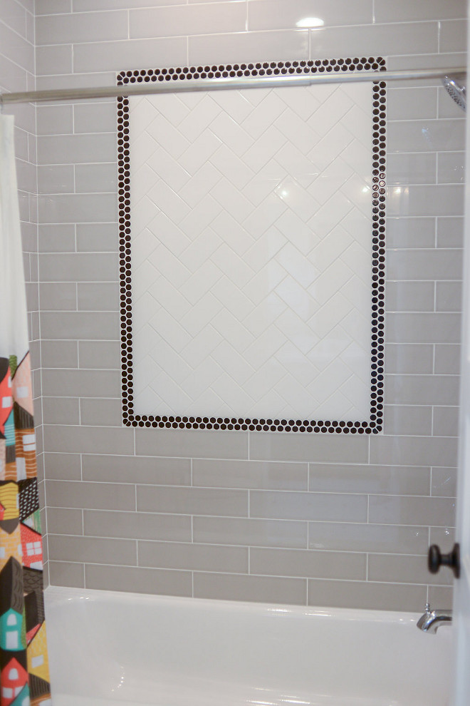 Bath wall tile. Kitds bathroom wall tile. Kids bathroom wall tile Walls: H-Line, Pumice Glossy 4”x16”. Inset: 3x6 H-Line Cotton w/ Black Glossy Penny Tile. #bathroom #tile #walltile #bathwalltile #kidsbathroomtile Millhaven Homes