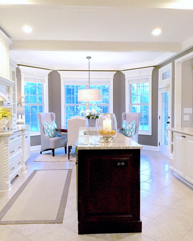 Kitchen cabinet. Island is Kraftmaid, espresso. Kitchen cabinets are Kraftmaid, Grandville Maple in Dove White with hazelnut cocoa distressed glaze. #kitchencabinet #glazedcabinets #darkisland Home Bunch Beautiful Homes of Instagram @blountdesigns