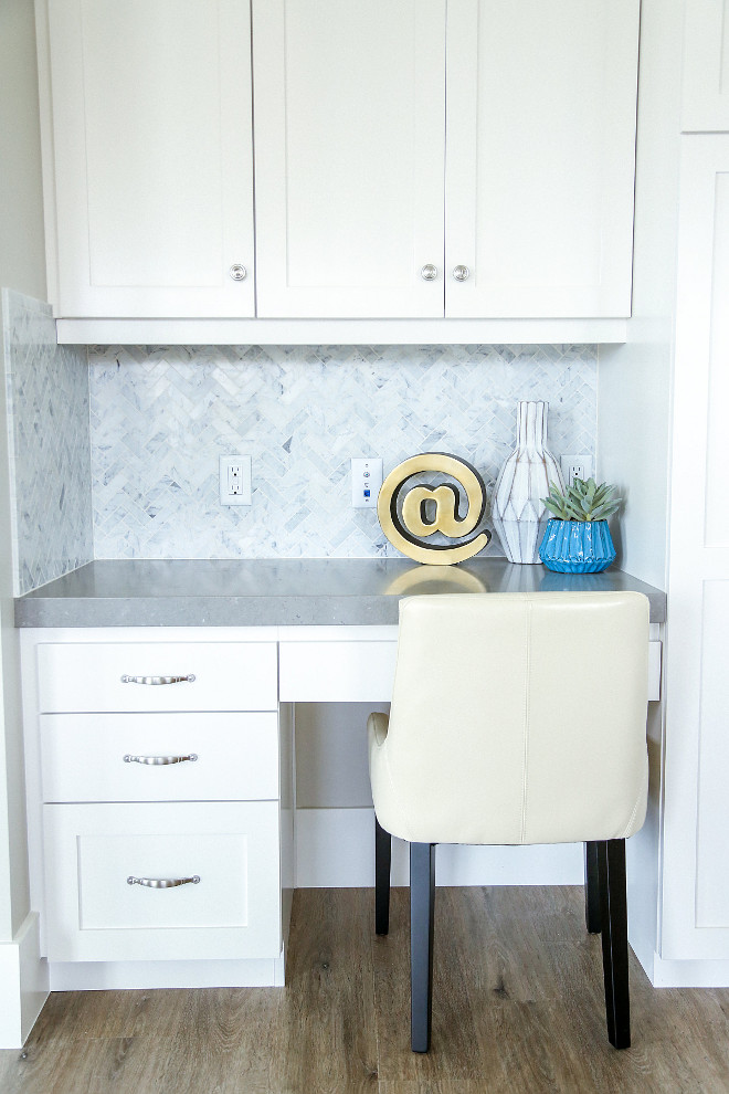 Thick Countertop. Cabinets feature brushed nickel pulls and knobs. Notice the thick gray quartz countertop. #thickcountertop Millhaven Homes