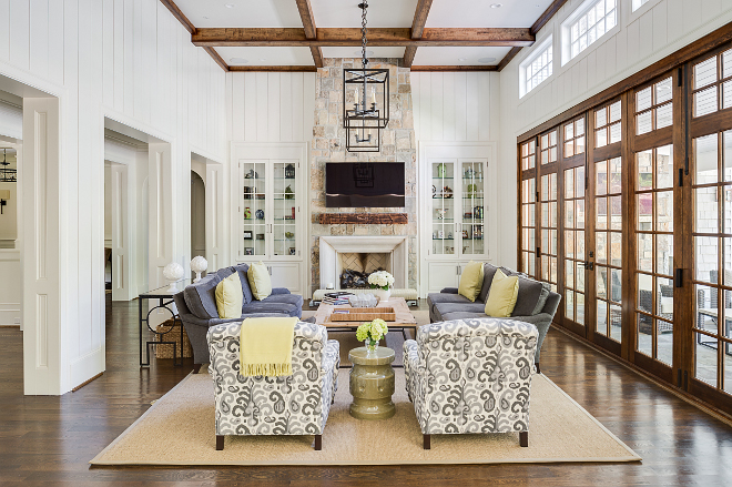 Living room. The designer kept the living room mostly in grays and whites which gives the home a relaxed feel. #livingroom Interiors by Courtney Dickey. Architecture by T.S. Adam Studio.