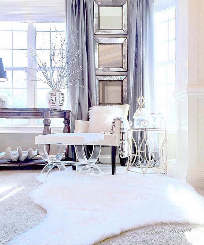 Master bedroom sitting room. Brushed velvet ivory chair with dark espresso legs: Restoration Hardware. Gold side table, white faux fur hide: HomeGoods. Antiqued square mirrors: Crate and Barrel. Gray silk drapery panels: Joss and Main. Hickory console table: Ashley Furniture. #masterbedroom #sittingroom master-bedroom-sitting-room Home Bunch Beautiful Homes of Instagram blountdesigns