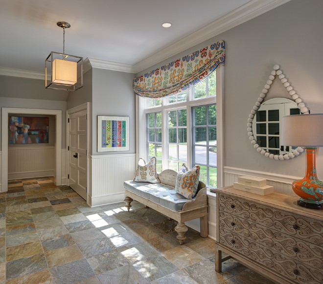 Mudroom Ideas: Bench & Fabric: Reclaimed lumber bench topped with throw pillows in Jim Thompson Karapinar fabric to match the stationary Roman valence. Lamp: Orange & blue lamp is from Bungalow 5. Mirror: Beaded white mirror is from Go Home. Paint color is Sherwin William SW 7015 Repose Grey. #mudroom #mudrooms sherwin-william-sw-7015-repose-grey-grey-mudroom-paint-color W Design