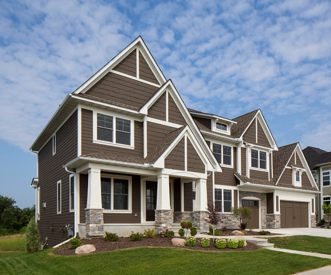 Whole home exterior color palette. The lap siding, shakes, lighting block and garage doors are Sherwin Williams SW7027 Well-Bred Brown. Trim and brackets paint color are Sherwin Williams SW7637 Oyster White sherwin-williams-sw7027-well-bred-brown #SherwinWilliamsSW7027WellBredBrown #Wholehome #exteriorcolorpalette #SherwinWilliamsSW7637OysterWhite Homes by Tradition