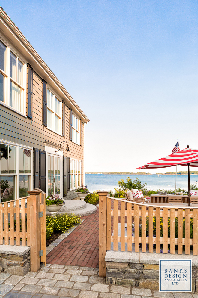 Shingle beach house. Every home comes with a story and there's plenty of stories to be said about this 1960s cedar shingle colonial beach house. The designer Linda Banks, from Linda Banks of Banks Design Associates and Simply Home, starts by explaining that this entire house was a rabbit warren of tiny rooms and her objective was to open it up to expose the views of Casco Bay and access the outdoor living areas. The homeowners, a young couple with two small children from New York City purchased an older beach house in Maine thinking of doing some minor repairs but a problem with frozen pipes during the winter lead to a major renovation, which served as a white canvas for the designer to create each space with more freedom. Despite the first troubles this property had, the homeowners knew they were in good hands to make the best of this home and to finally take full advantage of the stunning views of the Maine's coastline. Banks Design Associates, LTD & Simply Home