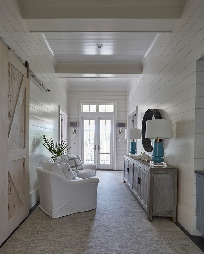 Shiplap foyer with barn door. Foyer features shiplap walls, shiplap ceiling and sliding barn door. #shiplap #foyer #barndoor #shiplapfoyer #barndoor #foyerbarndoor shiplap-foyer-and-barn-door Geoff Chick & Associates 