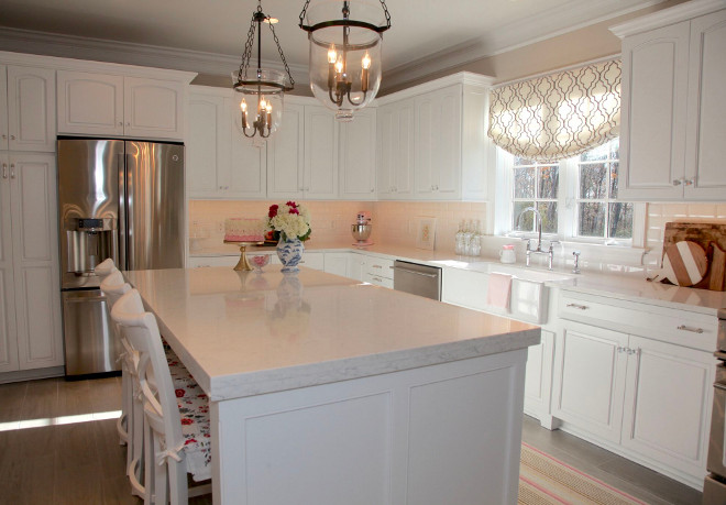 Kitchen island reno. We kept our existing island and added custom woodwork to expand the size and make it look like a custom piece of furniture. Not pictured is the fourth barstool we often add at the end of our island so our family can eat together. I’ve seen this recommended before, and will emphasize the advice to build the largest island you can fit – you will not regret having the space. Island Dimensions: 7 feet long x 3.5 feet wide. Countertops: LG Viatera Minuet Quartz with double-thickness island. #kitchenisland #kitchenreno #kitchenislandreno Home Bunch's Beautiful Homes of Instagram peonypartydesigns