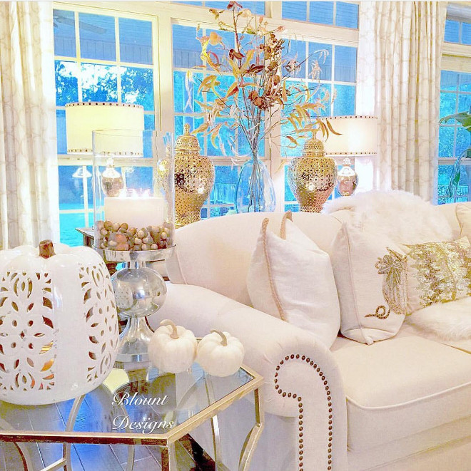 White & Gold Fall Decor: White pierced ceramic pumpkin, Demijohn: Pottery Barn - Sofa: Joss and Main - Gold pierced Ginger Jars: Zgallerie - Side table, Sequined lumbar pillows, Pumpkin Pillows: HomeGoods white-and-gold-fall-decor Home Bunch Beautiful Homes of Instagram @blountdesigns