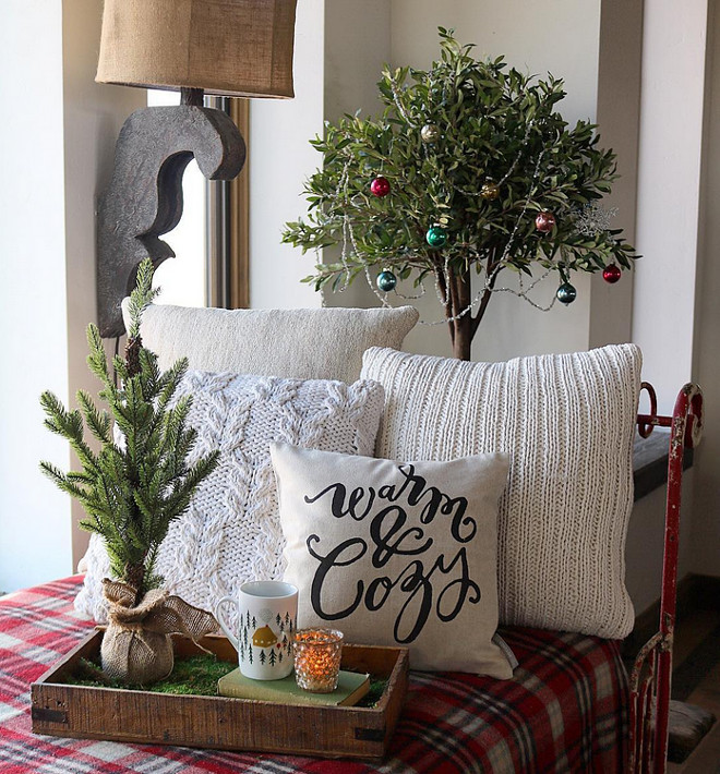 Farmhouse Christmas Decor. A rustic wood tray on a vintage day bed creates a cozy Christmas motiff. Farmhouse Christmas Decor. Farmhouse Christmas Decor Ideas #FarmhouseChristmasDecor #FarmhouseChristmasDecorIdeas #ChristmasDecor Home Bunch's Beautiful Homes of Instagram @birdie_farm