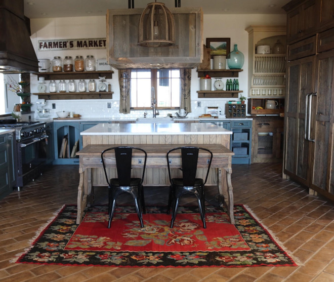 Rustic kitchen island with antique table. An antique table is placed against the kitchen island to extend the size of the island and to be easily accessed by small children. The kitchen island features an antique table. #Rustickitchen #kitchenislandtable #islandtable #antiquetable Home Bunch's Beautiful Homes of Instagram @birdie_farm