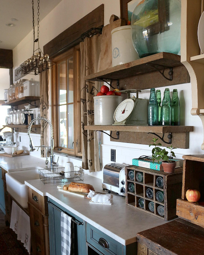 Rustic kitchen open shelves. Rustic Open Shelves. The open shelving also adds to the farmhouse charm that we adore. For the open shelves, we used 2 x 12 solid oak. It's two slabs, the bottom is glued and brad nailed into the wall, and then I found antique brackets to hold up the second slab that is the shelf. Rustic kitchen open shelves. Rustic Open Shelf ideas #Rustickitchen #openshelves #RusticOpenShelves Home Bunch's Beautiful Homes of Instagram @birdie_farm