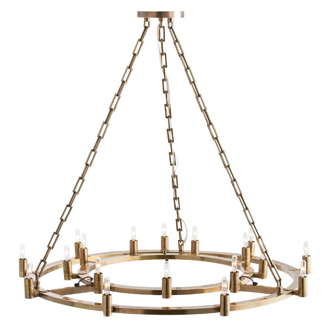 Arteriors Kaylor Fixed Chandelier. This ring-inside-a-ring brass chandelier has 18 lights and is finished in antique brass. Each of the sockets pivots 320 degrees so the bulbs can be turned at different angles. How cool is that??? Large enough to comfortably hang over most dining tables. Shown with small clear tubular bulbs. #Arteriors #KaylorFixedChandelier #KaylorFixed #Chandelier #Arteriors