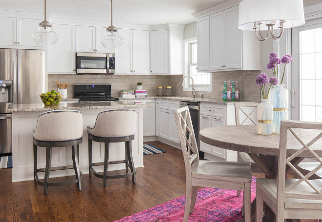 Benjamin Moore Simply White. Neutral white kitchen with pops of color. White cabinets are painted in Benjamin Moore Simply White. #BenjaminMooreSimplyWhite #NeutralKitchen