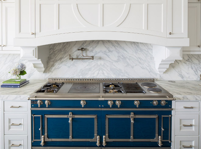 Blue range. French range. Backsplash is Calcutta Extra and the blue range is a French La Cornue range in cobalt blue. French La Cornue range in cobalt blue #FrenchRange #Bluerange #LaCornue #LaCornuerange #cobaltblue Martha O'Hara Interiors