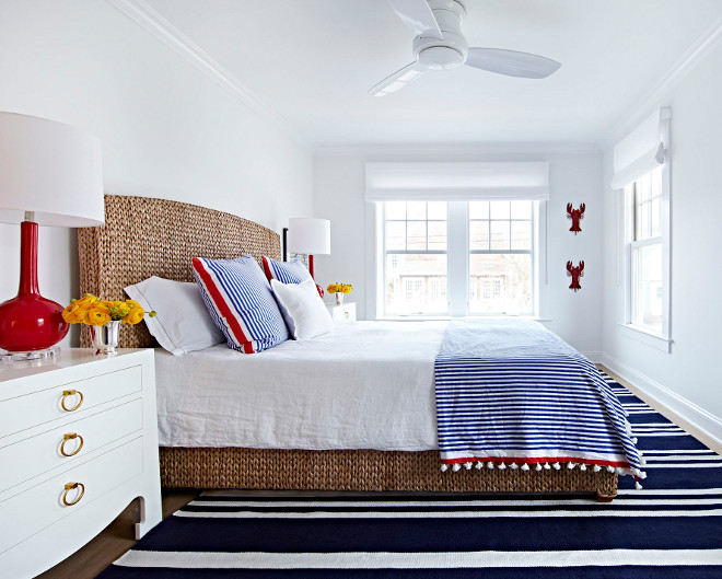 Coastal Bedroom. Coastal Bedroom with blue and white striped rug and navy and red decor. #CoastalBedroom Chango & Co.