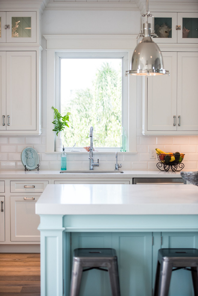Coastal White Kitchen with Driftwood Floors and turquoise island. Coastal White Kitchen with Driftwood Floors, turquoise island, inset cabinets and white subway. Kitchen with craftsman trim and white quartz countertop #CoastalWhiteKitchen #CoastalKitchen #CoastalKitchen #DriftwoodFloors #turquoiseisland #turquoisekitchenisland #insetcabinets #whitesubway #Kitchen #craftsmanwindowtrim #windowtrim #whitequartzcountertop #quartzcountertop #whitecountertop Waterview Kitchens