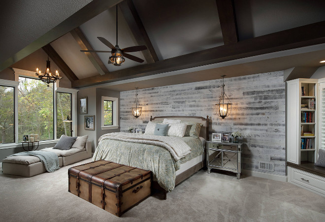 Farmhouse Bedroom. Farmhouse Bedroom with beamed vaulted ceiling, shiplap accent wall, dark grey walls and a sitting area. Farmhouse Bedroom #FarmhouseBedroom Barrington Homes Inc.