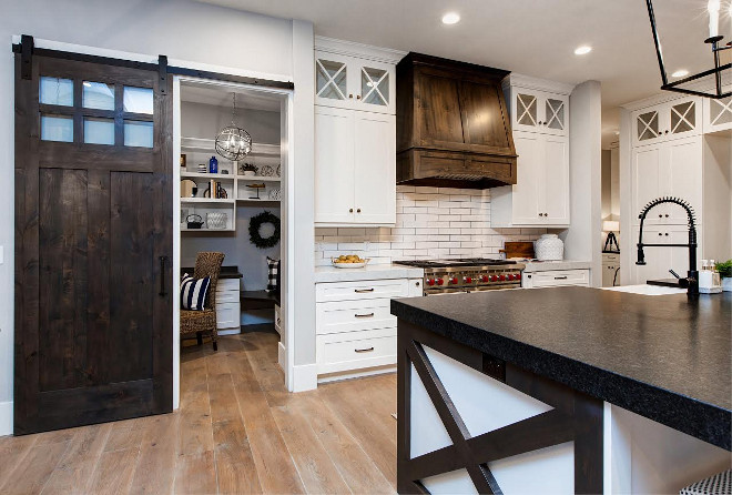 Farmhouse Kitchen Barn Door and Stained Wood Hood. Farmhouse Kitchen Barn Door and Stained Wood Hood. Farmhouse Kitchen Barn Door and Stained Wood Hood Design #Farmhouse #FarmhouseKitchen #BarnDoor #FarmhouseBarnDoor #StainedWoodHood #StainedKitchenHood Timberidge Custom Homes