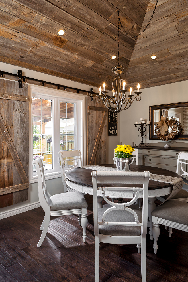 Farmhouse dining room furniture. A set of barn doors complements the rustic ceiling. Barn door track hardware: Richards-Wilcox. Farmhouse dining room furniture ideas. Farmhouse dining room furniture #Farmhouse #diningroomfurniture Hardcore Renos