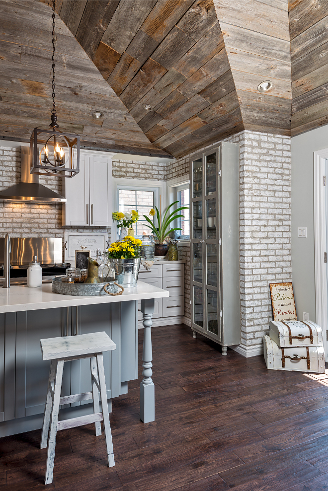 Farmhouse kitchen with whitewashed brick wall, reclaimed wood shiplap and grey island. #Farmhouse #kitchen #whitewashedbrickwall #reclaimedwoodshiplap #greyisland Hardcore Renos