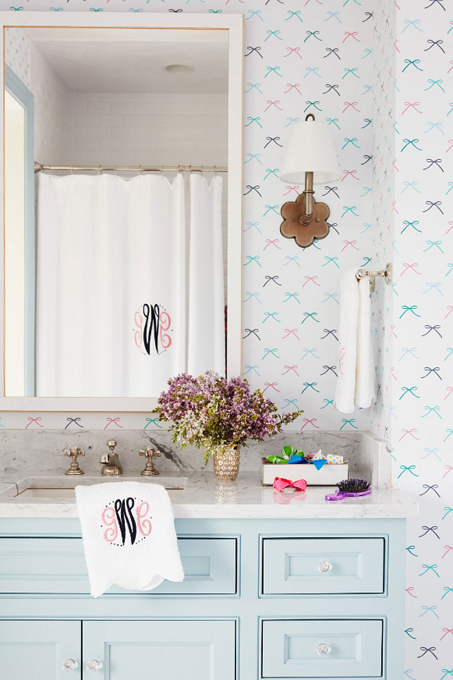 Girls Bathroom. Girls Bathroom with light turquoise vanity and bow wallpaper. The light turquoise vanity works perfectly with the Dabney Lee's bow wallpaper. The light turquoise paint color used on the vanity is "Benjamin Moore 2123-50 Ocean Air". Girls Bathroom. Girls Bathroom with light turquoise vanity and bow wallpaper ideas #GirlsBathroom #GirlsBathroomwallpaper #lightturquoisevanity #bowwallpaper #BenjaminMoore212350OceanAir #BenjaminMoore212350 #BenjaminMooreOceanAir Andrew Howard Interior Design