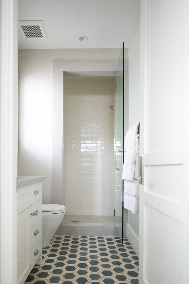 Hand painted hexagon tile. This bathroom is accented with custom hand painted hexagon decorative field tile, while the shower is covered in floor to ceiling 2"x8" bone-colored mechanical field tile. Hand painted hexagon tile #Handpaintedtile #hexagontile Patterson Custom Homes