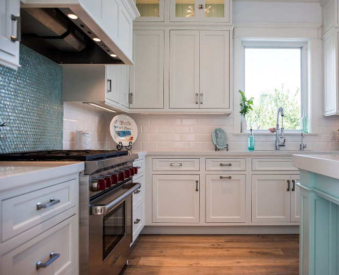 Kitchen Backsplash. The white beveled subway tiles are Porcelanosa Retro Bainco 4 x 8 White, Aqua glass penny tiles by Tesoro; Tesoro Listello Reflections Tourmaline Mosaic Penny Round Tile. The designer calls them "Mermaid's Tail!" Don't you just love that? Kitchen Backsplash #KitchenBacksplash #Kitchen #Backsplash