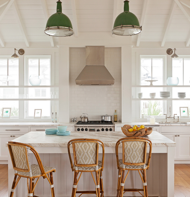 Kitchen shelves in front of window. Kitchen Window Shelves. Placed in front of windows, these open shelves create some extra storage without compromising the natural light while white china and glass keep the kitchen feeling neutral and airy. Open shelves in front of windows. #kitchen #windowshelves #openshelfwindows #openshelves #kitchenwindows Beau Clowney Architects. Jenny Keenan Design