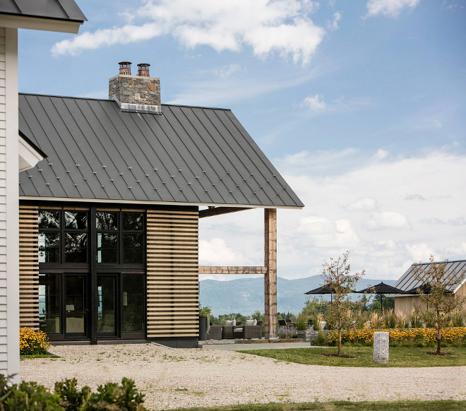 Metal roof and timber. Farmhouse with timber, metal roof and stone chimney. Farmhouse #farmhouse Roundtree Construction. TruexCullins Architecture + Interior Design