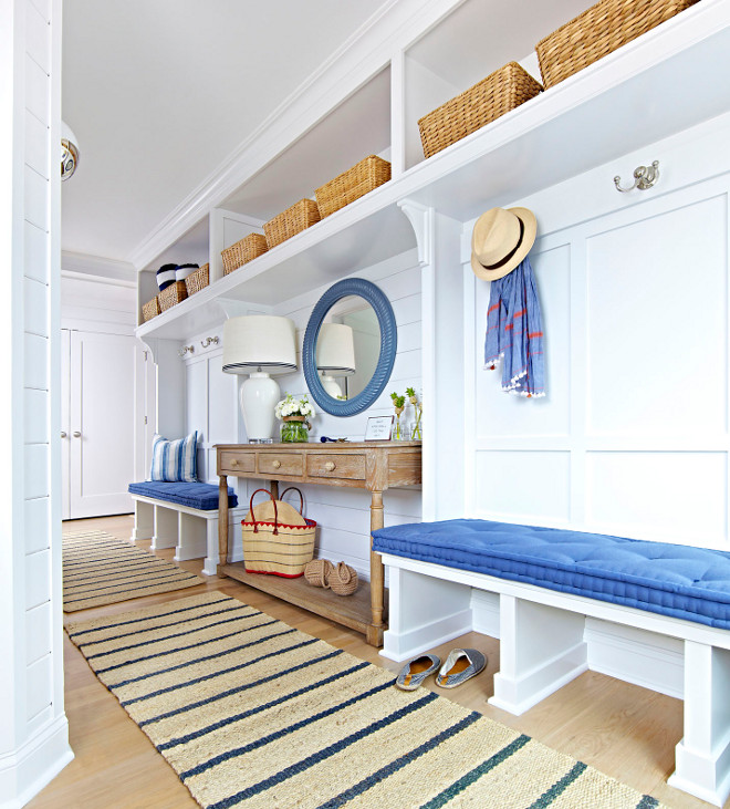 Mudroom. Mudroom Entry. Mudroom Entry with whitre oak flooring, shiplap walls, mundroom benches and open storage with baskets. #Mudroom #Mudroomentry #entry #shiplap #storage #mudroombenches #mundroombaskets #mudroomflooring #whiteoakflooring #openstorage Chango & Co.