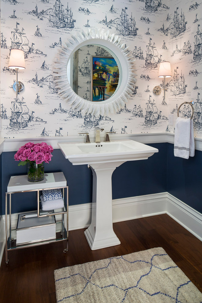 Powder Room Chair Rail design. Wall color is Benjamin Moore Newburyport Blue and the coastal wallpaper is by York Wallcoverings. Powder Room Chair Rail. Powder Room features Chair Rail, wallpaper and lowered wall painted in navy. #PowderRoom #ChairRail #ChairRaildesign Martha O'Hara Interiors