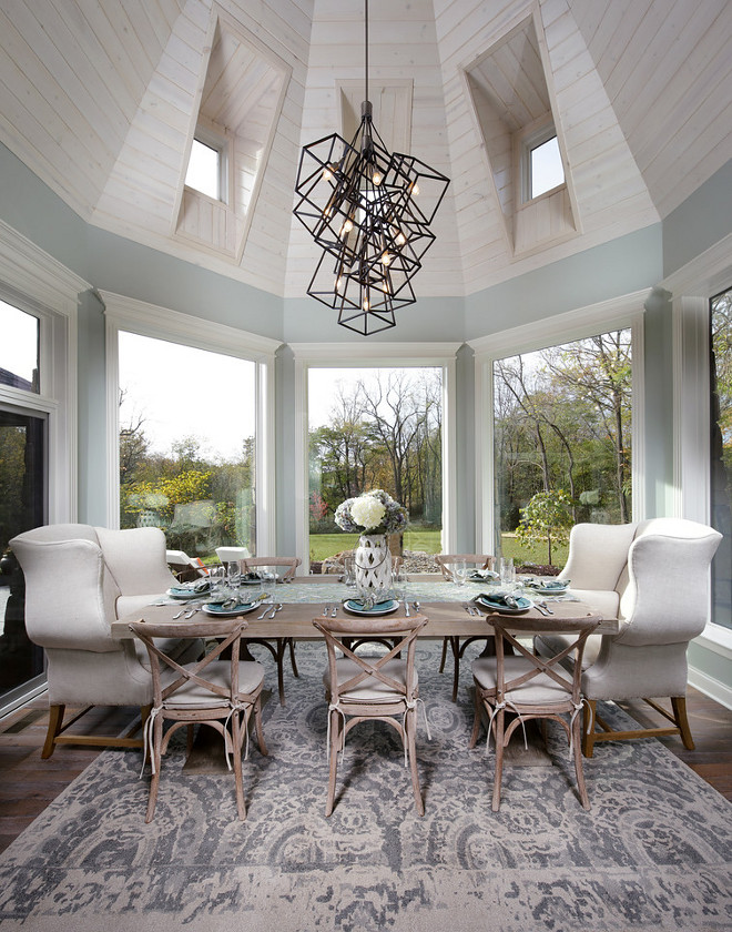 Sherwin Williams Comfort Grey SW 6205. Shiplap Dining Room ceiling. Elegant dining nook surrounded by windows and a dramatic shiplap ceiling. Paint color is Sherwin Williams Comfort Grey SW 6205. #diningroom #diningnook #shiplapceiling #SherwinWilliamsComfortGreySW6205. Barrington Homes Inc.