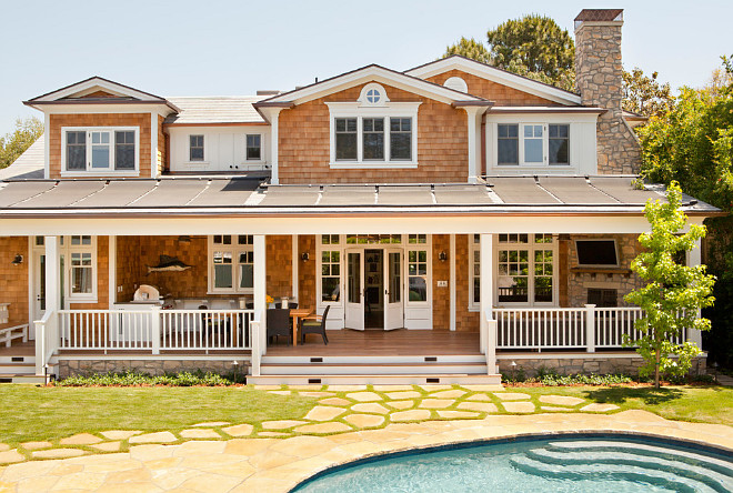 This home has two types of solar panels. The panels on the very top of the house are photo-voltaic and those above the porch are solar pool heating collectors. Tim Barber Ltd Architecture. Karyn Millet Photography.