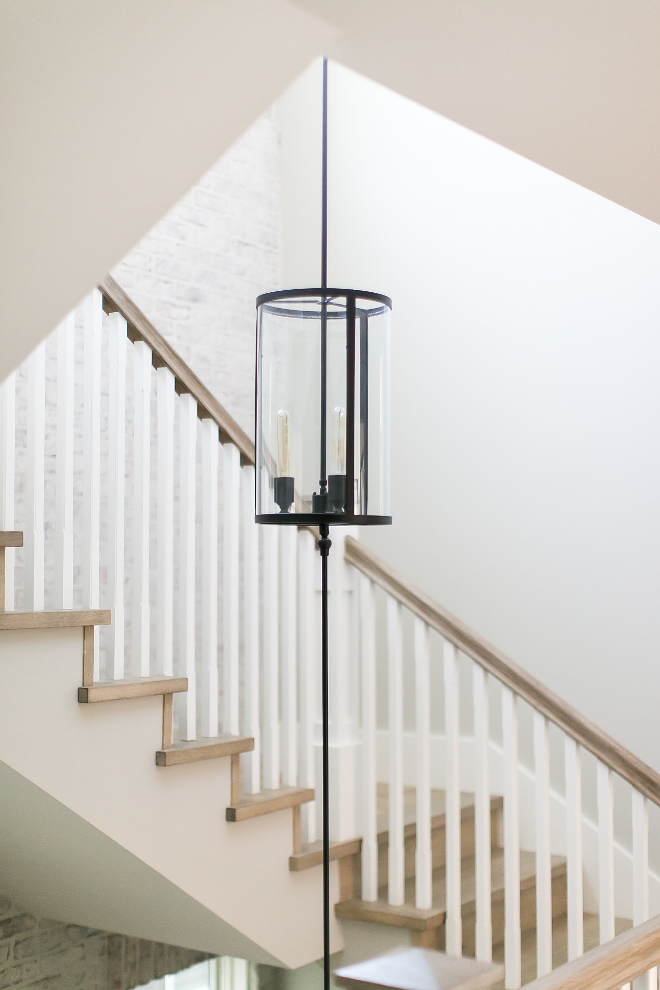 Three-story chandelier with a pendant at each of the floor's landings. This three-story chandelier was custom designed by "Elegance in Lighting" for this home. Custom Three-story chandelier with a pendant at each of the floor's landings. Patterson Custom Homes