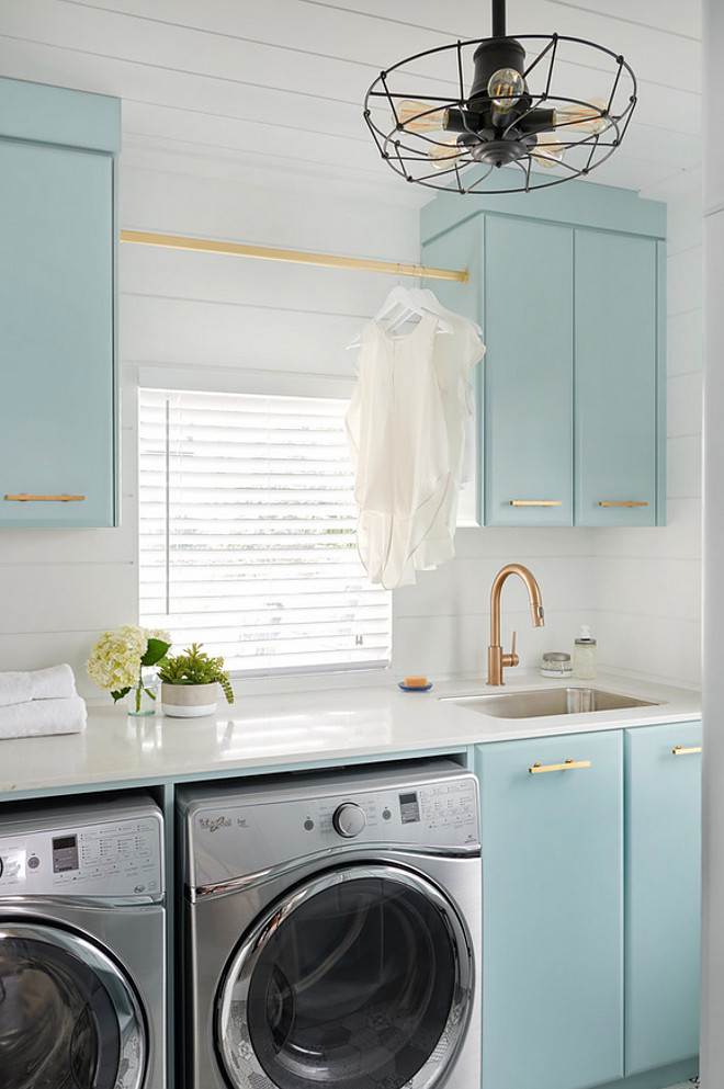 Tiffany's Blue Cabinet. Tiffany's Blue Cabinet Paint Color. Laundry room with matte brass hardware and Tiffany's Blue Cabinet. Tiffany's Blue Cabinet is Gossamer Blue by Benjamin Moore #TiffanysBlueCabinet #TiffanysBlue #Cabinet Soda Pop Design Inc.