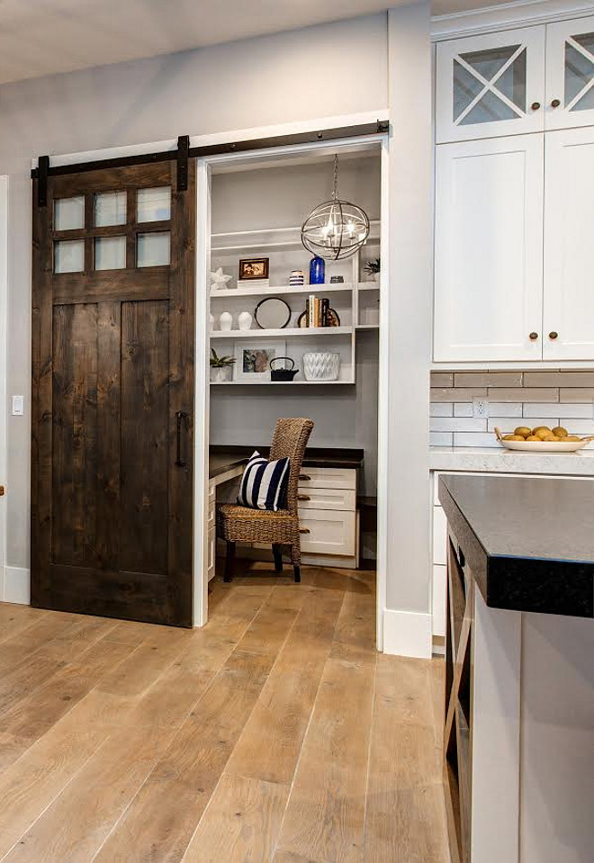 White Oak Plank Hardwood Floor and Barn Door. Barn door stain color is Smoke from jones paint and glass. Floors are natural White Oak 8" planks. Kitchen with White Oak Plank Hardwood Floor and Barn Door. #WhiteOakPlankHardwoodFloor #WhiteOak #PlankHardwoodFloor #HardwoodFloor #BarnDoor Timberidge Custom Homes