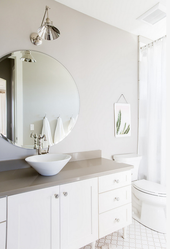 White and grey bathroom. Grey bathroom walls painted in Collonade Gray Sherwin Williams. White bathroom vanity painted in Alabaster Sherwin Williams. Countertop is grey quartz. White and grey bathroom. Small Grey bathroom walls painted in Collonade Gray Sherwin Williams. White bathroom vanity painted in Alabaster Sherwin Williams #Whiteandgreybathroom #Greybathroom #greywall #paintcolor #CollonadeGraySherwinWilliams #Whitevanity #AlabasterSherwinWilliams Timberidge Custom Homes