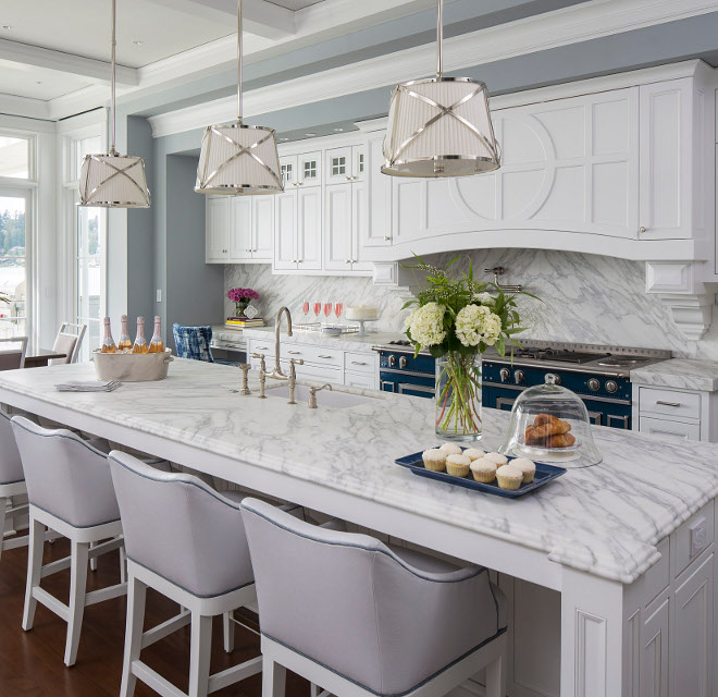 White classic kitchen with white marble countertop and white marble slab backsplash. The island countertop is white marble, Calcutta Extra, with a double ogee edge. White classic kitchen with white marble countertop and white marble slab backsplash ideas. White classic kitchen with white marble countertop and white marble slab backsplash #Whiteclassickitchen #Whitekitchen #classickitchen #whitemarblecountertop #whitemarble #countertop #whitemarbleslabbacksplash #whitemarblebacksplash #whitemarble #sl Martha O'Hara Interiors