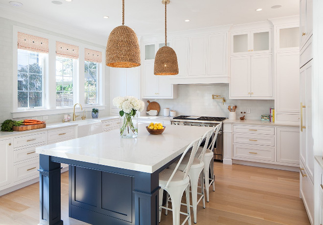 White and navy kitchen. White kitchen with navy island and wicker pendants. #Whitekitchenwithnavyisland #whiteandnavykitchen #wickerpendants Victoria Balson Interiors