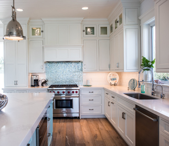 White quartz countertop. White kitchen with inset cabinets and white quartz countertop. Countertops Material: Caesarstone Calacatta Nuvo 3" miter on the Island Caesarstone Frosty Carrina on the perimeter of the kitchen. #Whitequartzcountertop #quartzcountertop #Whitekitchen #insetcabinets #insetkitchencabinets #whitecountertop Waterview Kitchens