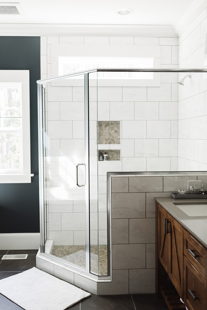 Bathroom shower wall, The semi-frameless glass shower and transom window lets light flood the rest of the bathroom. Bathroom shower wall ideas. Bathroom shower wall dimensions, Bathroom shower wall #Bathroomshowerwall #Bathroom #showerwall #showerwallideas Beautiful Homes of Instagram @thegraycottage