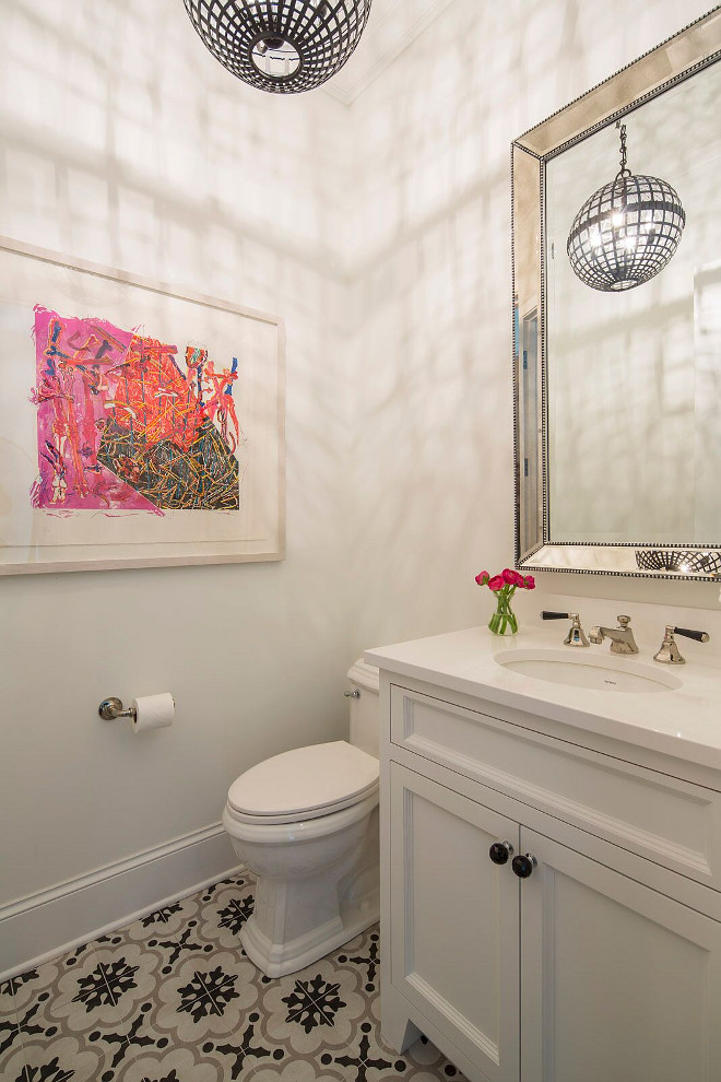 Cement Tile Bathroom, An iron sphere chandelier hung in front of a Restoration Hardware Beaded Venetian Mirror is mounted above a white single washstand with black knobs and a white quartz countertop and an oval sink. The floor is accented with gray and black cement floor tiles. The black and white cement tile was selected at Tile x Design, Bathroom with black and white cement tile #blackandwhitecementtile #cementtile #cementtiling #bathroomcementtile Martha O'Hara Interiors. John Kraemer & Sons