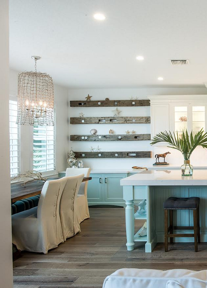 Coastal Dining room with reclaimed shelves and turquoise built in cabinet. The amazing light is from Shades of Light. It is called the Jute Rope Weave Lantern Large. Coastal Dining room with reclaimed shelves and turquoise built in cabinet ideas #CoastalDiningroom #Diningroom #coastalinteriors #Reclaimedshelves #turquoisecabinet Waterview Kitchens