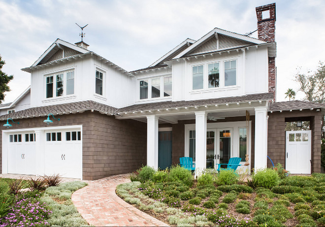 Coastal Shingle Home with Turquoise Barn Lighting above Garage Doors and Turquoise Adirondack Chairs #CoastalShingleHome #Turquoise #BarnLighting #Barnsconces #GarageDoors #GarageDoorlighting #TurquoiseAdirondackChairs AdirondackChairs