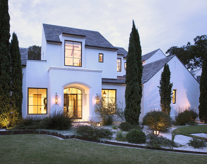 White exterior with black steel windows and black steel doors. Crisp architectural home with white exterior and black steel windows and black steel doors and slate roof. #Crisparchitect #home #architecturalhome #whiteexterior #blacksteelwindows #blacksteeldoors #slateroof Ryan Street & Associates