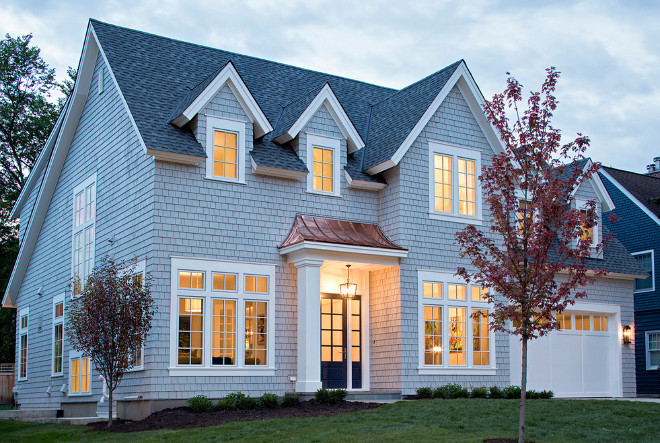 Grey Shingle style home. Grey Shingle style home with copper roof detail and navy front door. Grey Shingle style homes Grey Shingle style home #GreyShinglestylehome. #GreyShinglehome #Greyhome #Shinglestylehome Martha O'Hara Interiors. John Kraemer & Sons